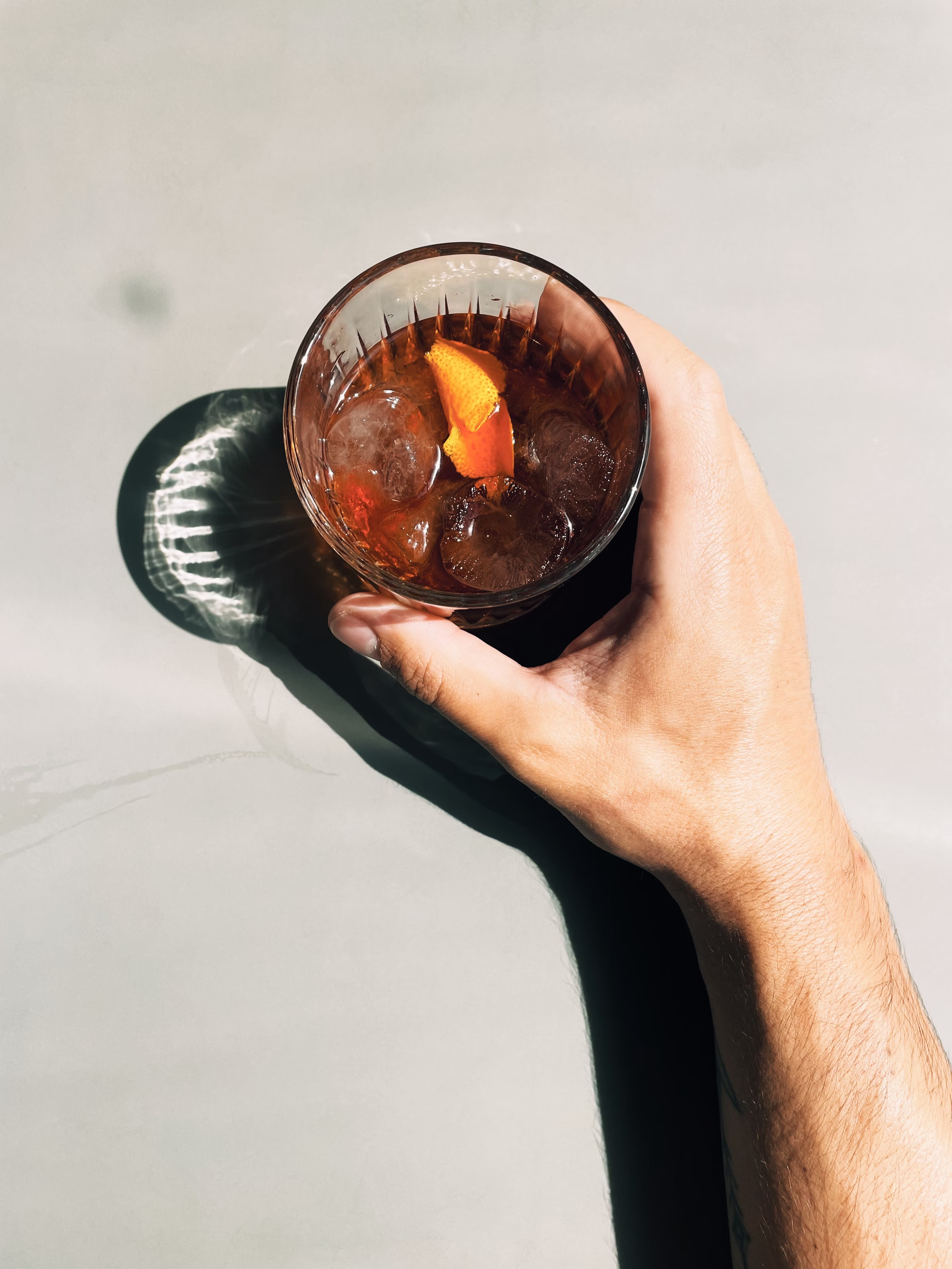hand holding cocktail
